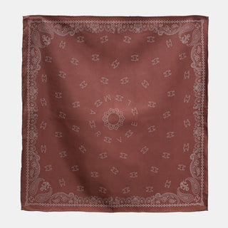 Indian red silk neckerchief with intricate paisley border, featuring 'MARVEL' text and decorative patterns in white thread with hand-rolled edges