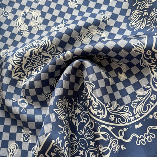 Baroque silk scarf in Steel Blue featuring elegant checkered pattern with ornate paisley and floral designs, showcasing luxury hand-rolled finish
