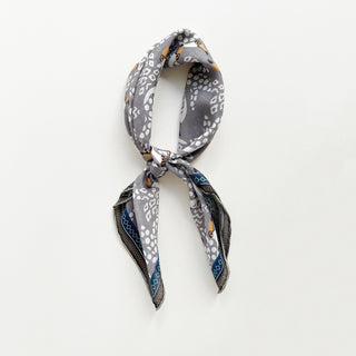 Amazon toucan organic cotton-silk scarf in stone grey with featuring contrast border, knotted loosely as a neck scarf