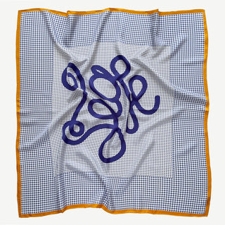 90cm women’s checkered and houndstooth silk square scarf in blue and white with orange border and hand-rolled edges, flat lay.