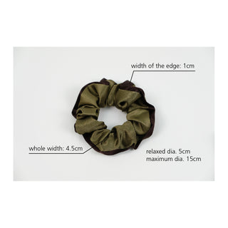Handmade silk scrunchie with olive green fabric and dark brown edge, shown with measurement details including 4.5cm width and 5cm relaxed diameter.