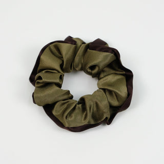 Luxurious 100% silk scrunchie with khaki green center and deep brown trim, showing soft ruffled texture against white background