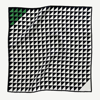 53cm geometric silk bandana with black and white triangle pattern and green corner, hand-rolled hems.