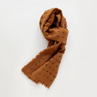 Burnt mustard pure cashmere scarf featuring openwork jacquard design.
