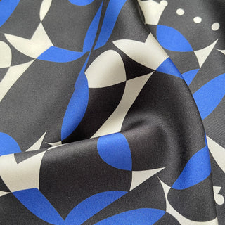 Close-up of women’s silk scarf 90cm in pebble-inspired print, English seaside tones, large square with hand-rolled hems by LuluLane.