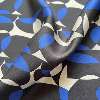 Close-up of women’s silk scarf 90cm in pebble-inspired print, English seaside tones, large square with hand-rolled hems by LuluLane.