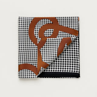 Black and white checkered silk scarf with rust orange pattern by LuluLane on a light grey background