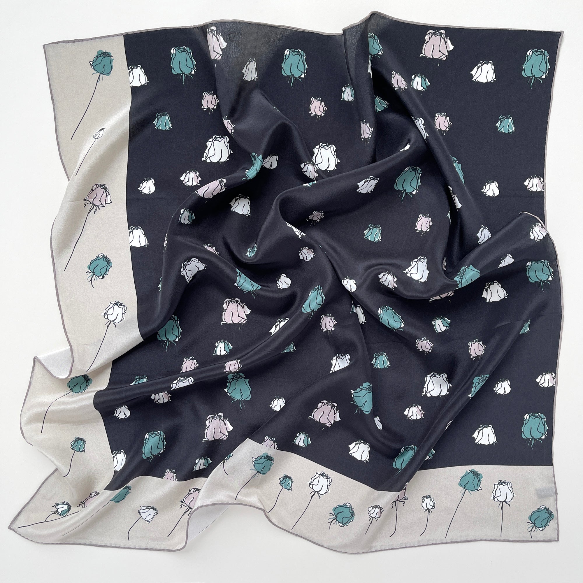 a luxury floral rose black silk scarf with beige edge, featuring hand-rolled hems