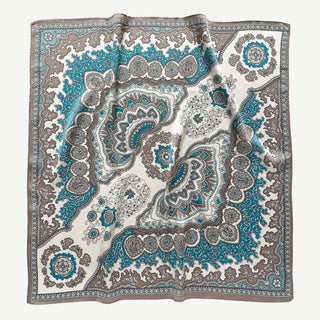Square silk scarf with intricate baroque pattern in teal blue, cream and brown featuring ornate medallions and paisley designs with decorative border