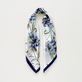 women's silk scarf with blue bell floral pattern on white background, bordered with navy blue edges