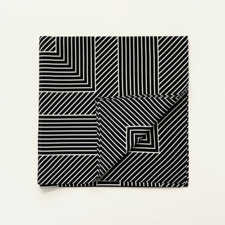 Women’s black and white geometric silk scarf in 90x90cm square design with subtle LOVE lettering and minimalist stripe pattern