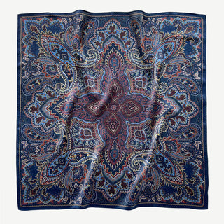 Navy blue silk neckerchief with intricate burgundy and gold paisley pattern, displayed flat to showcase detailed boho design and luxurious texture