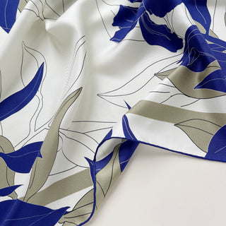 Women’s blue iris silk scarf in 65cm square size, floral silk twill scarf with double-sided print and hand-rolled edges