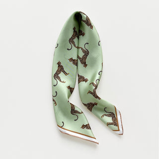 Mint green silk scarf with brown and black leopard print pattern and soft rose gold hand-rolled edges