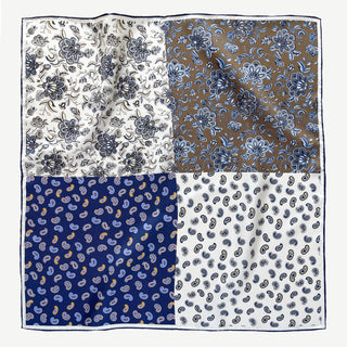 Flat lay of men’s 53cm silk neckerchief with patchwork paisley and floral design in navy, olive brown, and cream, double-sided print.