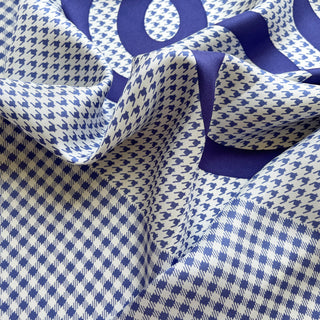 Close-up of checkered and houndstooth silk twill scarf in blue and white