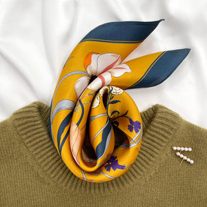 vintage vibe silk bandana scarf in vibrant mustard yellow featuring flowers and butterflies print with dark blue edge