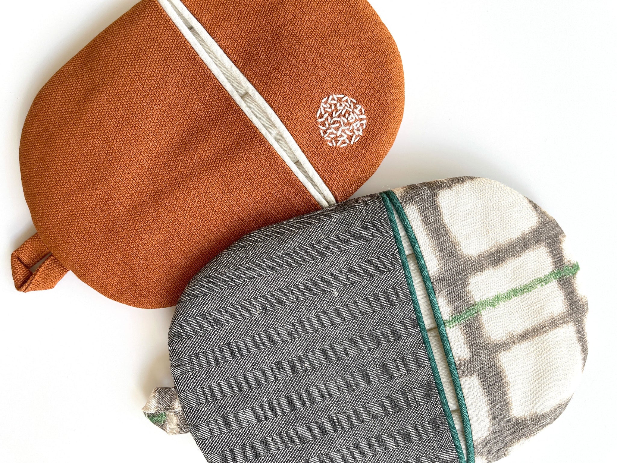 two exquisite linen pot holders/oven mitts featuring patchwork design and handmade embroidery 