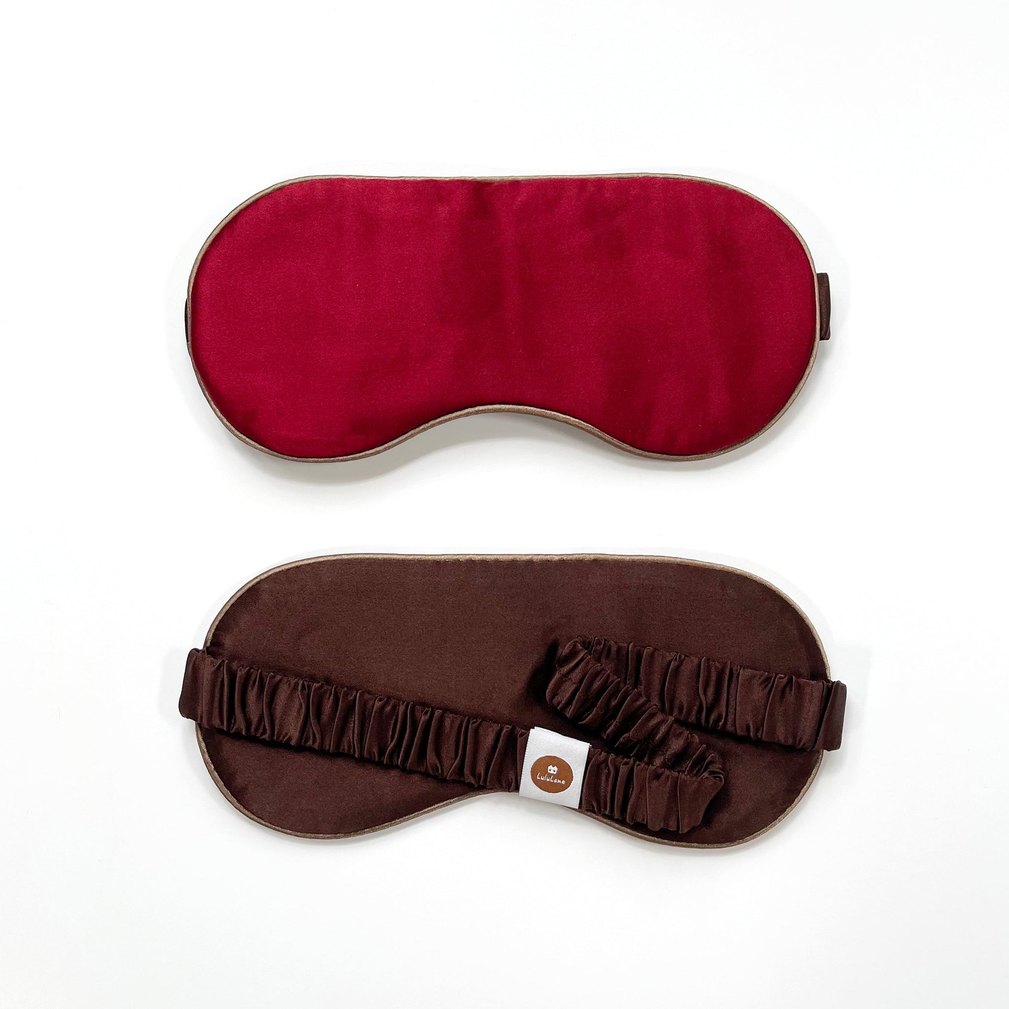 a professionally designed and handmade red silk eye mask with brown elastic strap and back side