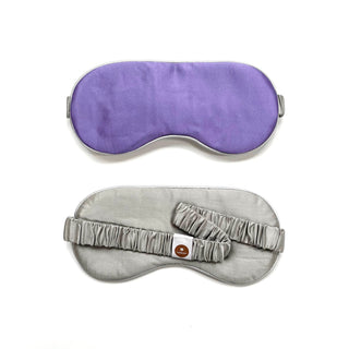 Double-sided luxury silk sleep mask - rich purple on one side, elegant silver gray on the reverse with elastic band and brand tag